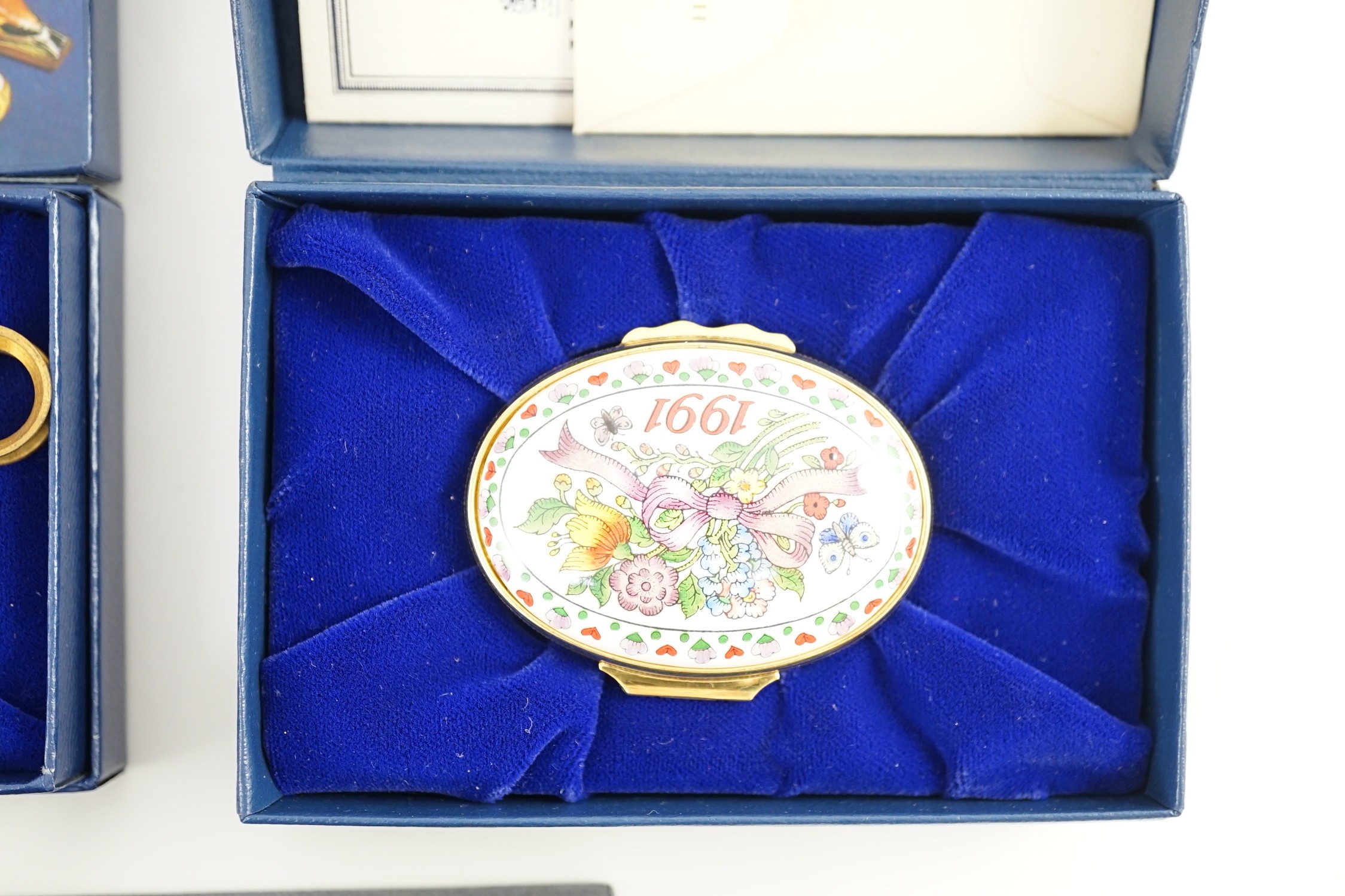 Two Halcyon Days enamel boxes; frog and 1991, two Dubarry boxes and a white metal model elephant, all boxed.